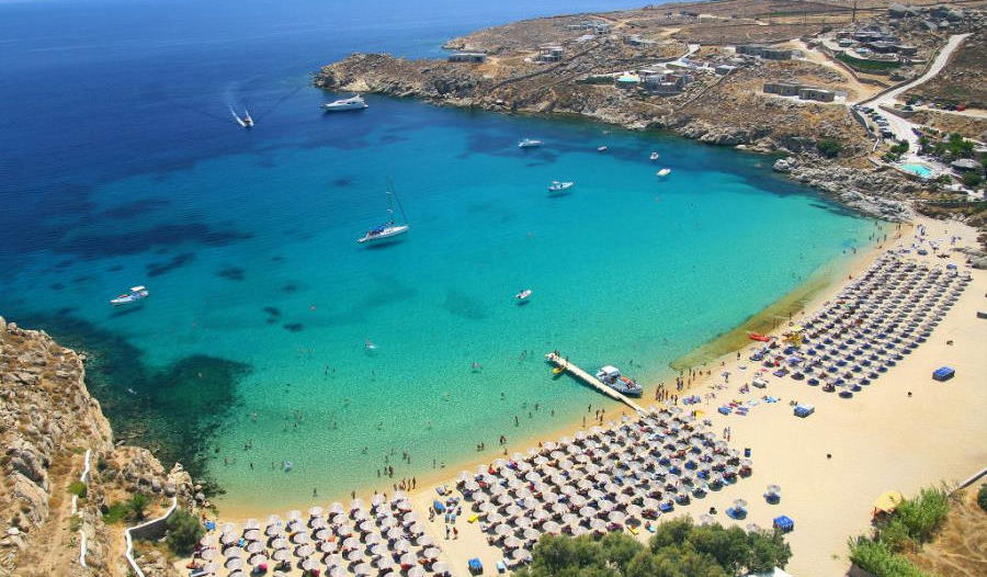 Go to a beach party at Super Paradise beach in Mykonos